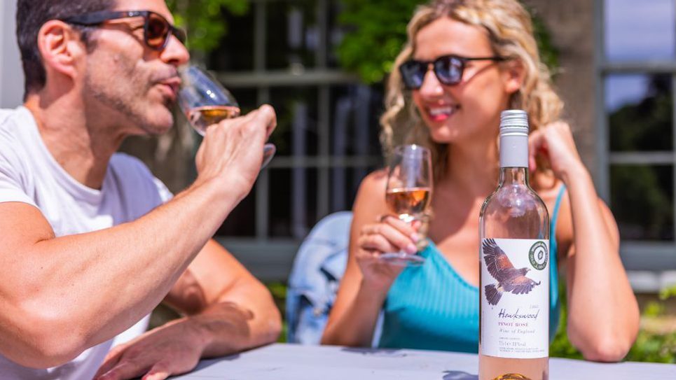 Hawkswood Vineyard couple drinking 965x540
