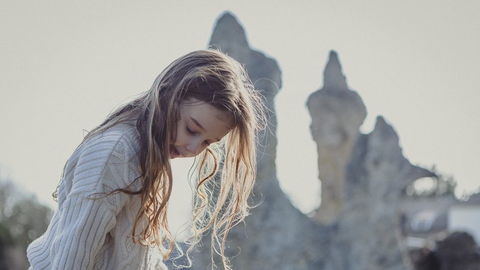 Little girl in Abbey Ruins Uniquely Emily Jackaman 965x540