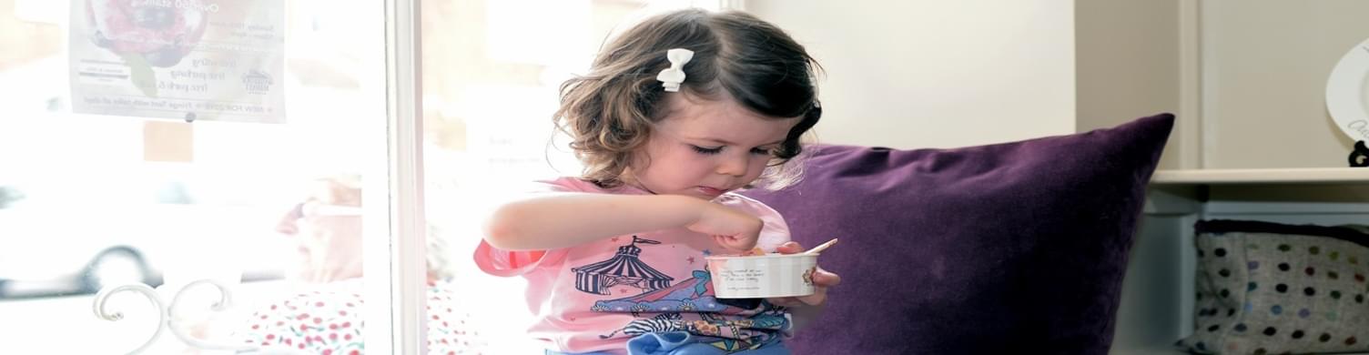Little girl eating ice cream Rebecca Austin 1500x390