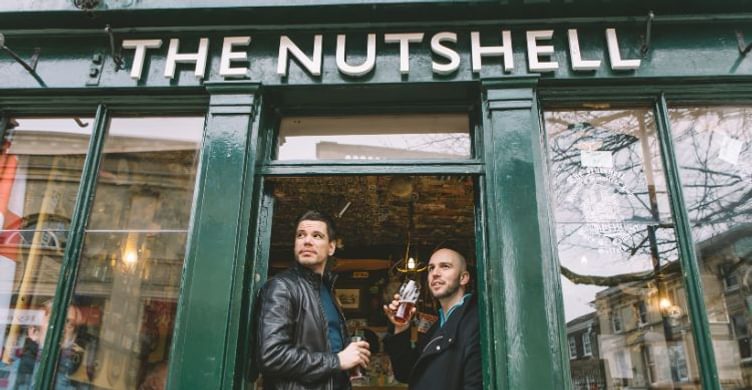 Nutshell exterior two men having a pint 750x390